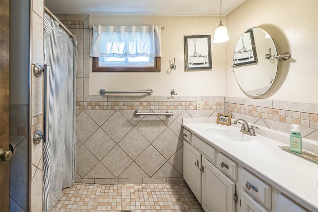 9 E Division St, North East, PA 16428 - full bathroom featuring tile walls, vanity, curtained shower, tile patterned flooring, and wainscoting