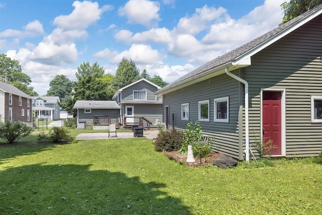 9 E Division St, North East, PA 16428 - back of property with a yard and a patio