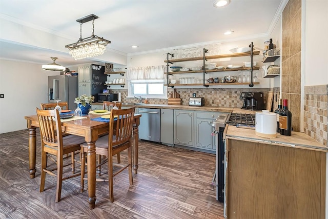 9 E Division St, North East, PA 16428 - kitchen with appliances with stainless steel finishes, open shelves, ornamental molding, gray cabinetry, and backsplash