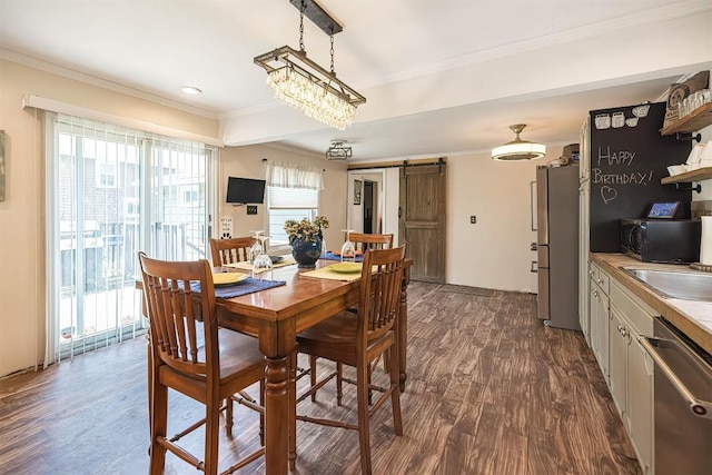 9 E Division St, North East, PA 16428 - dining area featuring a barn door, ornamental molding, and dark wood-type flooring