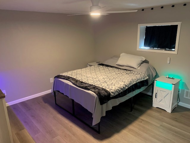 6028 Davidson Rd, Jamestown, PA 16134 - bedroom featuring wood finished floors, baseboards, and ceiling fan