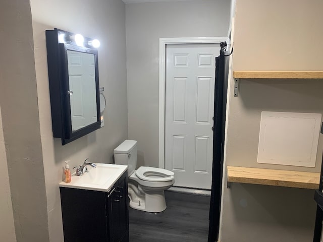 6028 Davidson Rd, Jamestown, PA 16134 - bathroom with wood finished floors, toilet, and vanity