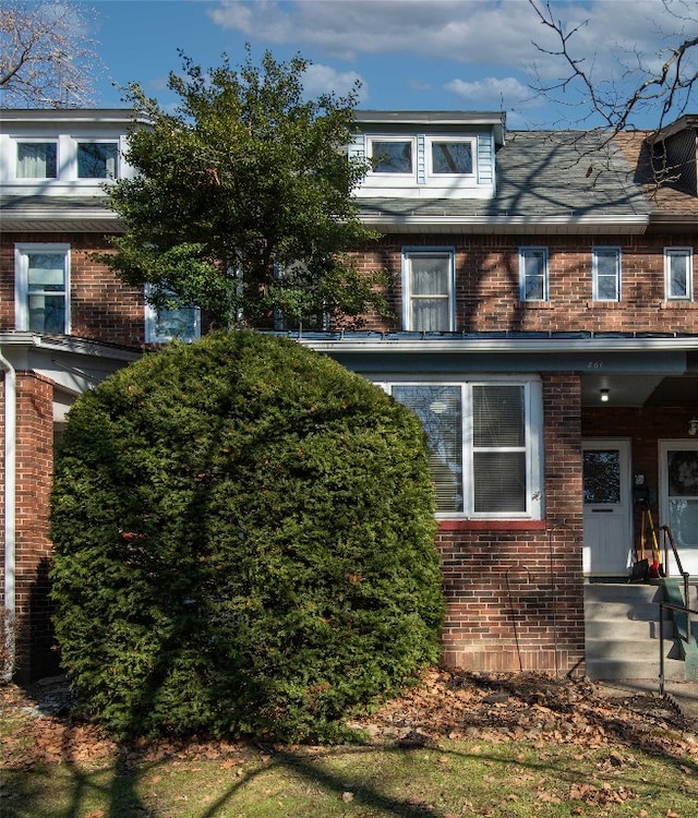 view of front of home with brick siding