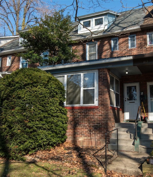 view of property exterior with brick siding