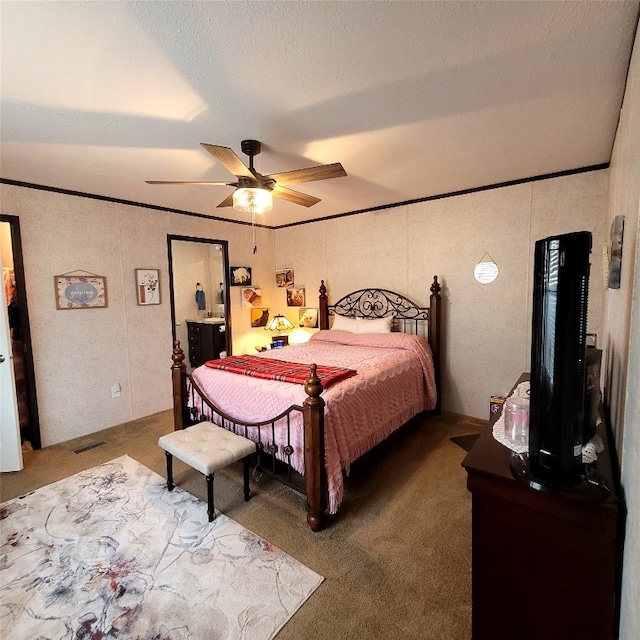 bedroom featuring ceiling fan, carpet, and ornamental molding