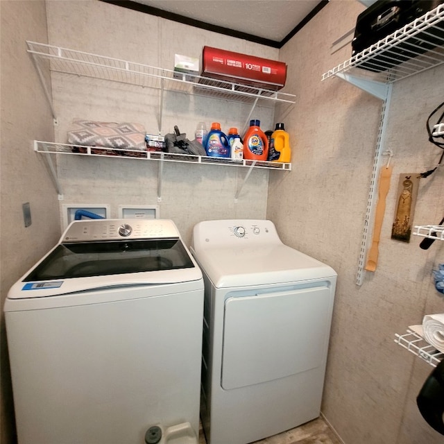 clothes washing area with independent washer and dryer