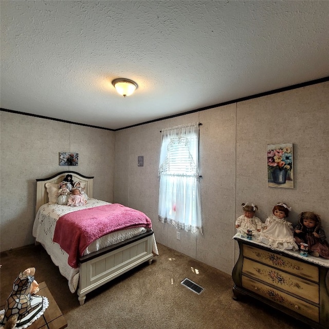 carpeted bedroom with a textured ceiling