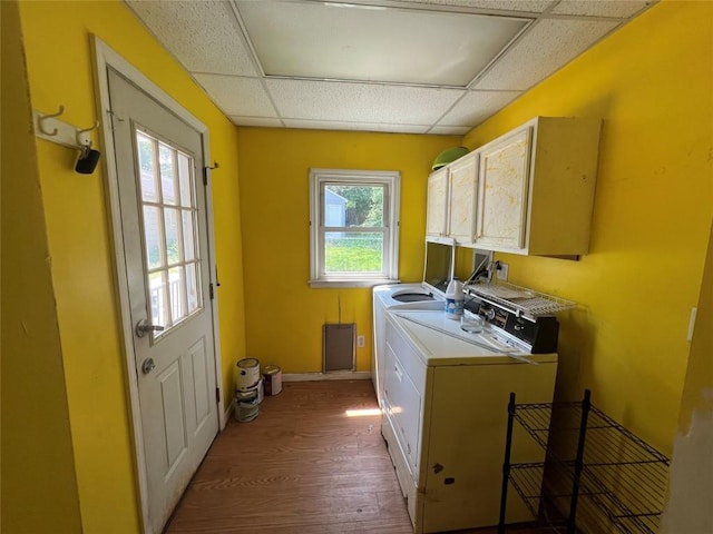 113 E 29th St, Erie, PA 16504 - laundry room with independent washer and dryer, cabinet space, wood finished floors, and baseboards