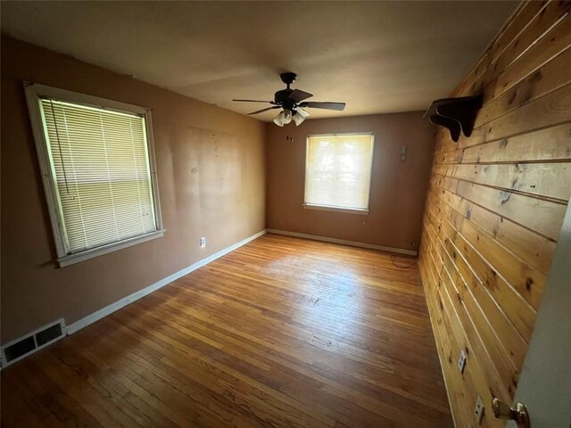 113 E 29th St, Erie, PA 16504 - empty room featuring wood finished floors, baseboards, and ceiling fan