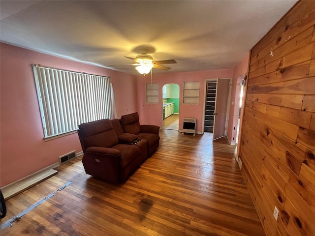 113 E 29th St, Erie, PA 16504 - living area featuring hardwood / wood-style floors, heating unit, a ceiling fan, and baseboards