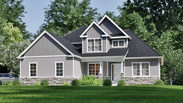 craftsman-style home with stone siding, board and batten siding, a front yard, and roof with shingles