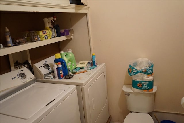 clothes washing area with washing machine and clothes dryer