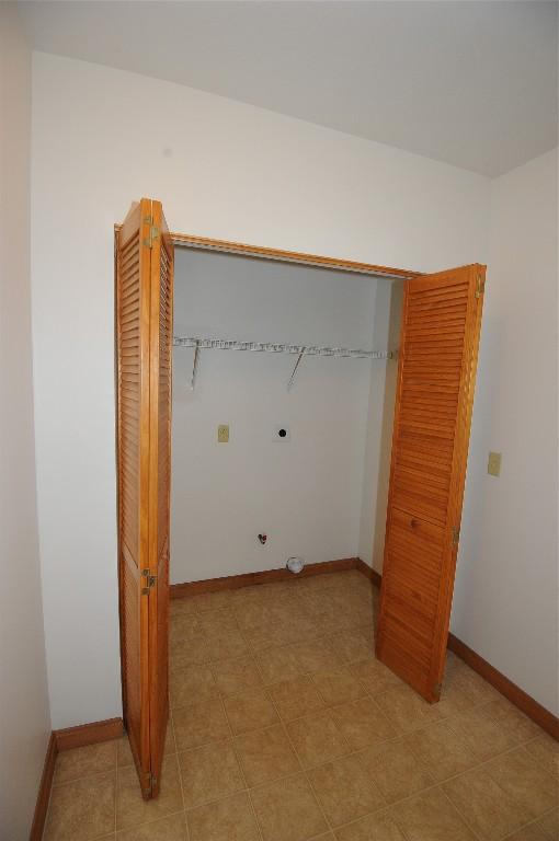 clothes washing area featuring hookup for an electric dryer