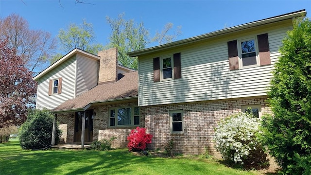 549 Kinsman Rd, Jamestown, PA 16134 - rear view of property featuring a yard and brick siding