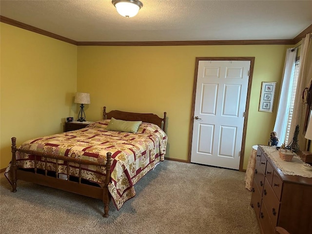 bedroom featuring light carpet, a textured ceiling, and ornamental molding