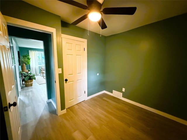 12013 Teifer Ave, Conneaut Lake, PA 16316 - spare room with a ceiling fan, wood finished floors, and baseboards