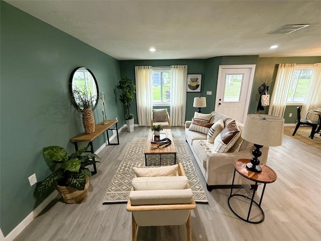 12013 Teifer Ave, Conneaut Lake, PA 16316 - living area featuring baseboards, plenty of natural light, wood finished floors, and recessed lighting