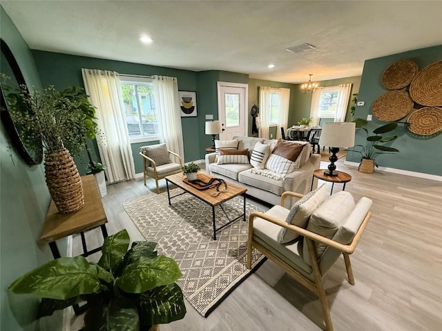 12013 Teifer Ave, Conneaut Lake, PA 16316 - living room featuring a chandelier, light wood-type flooring, baseboards, and recessed lighting