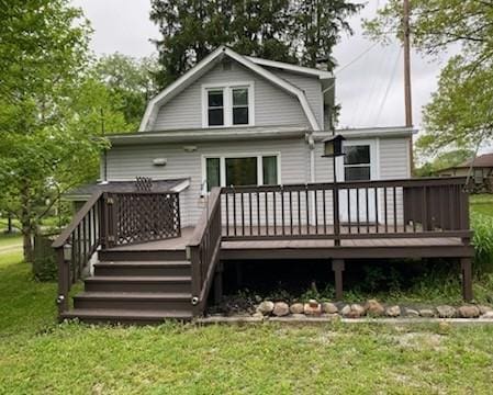 19437 Green Mountain St, Meadville, PA 16335 - rear view of house with a gambrel roof, a lawn, and a deck