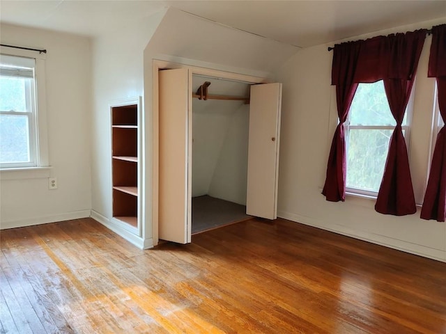 19437 Green Mountain St, Meadville, PA 16335 - unfurnished bedroom featuring light wood finished floors, multiple windows, lofted ceiling, and a closet