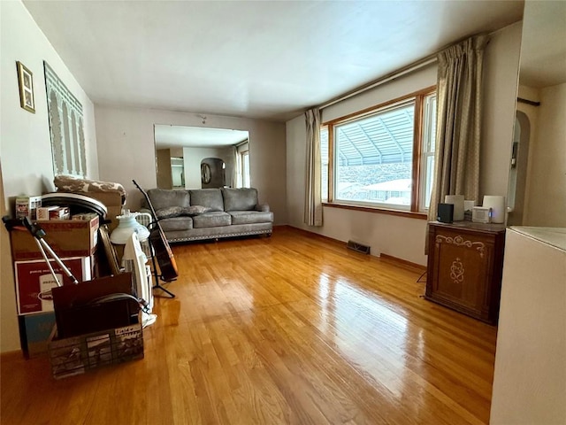 living room with light hardwood / wood-style flooring