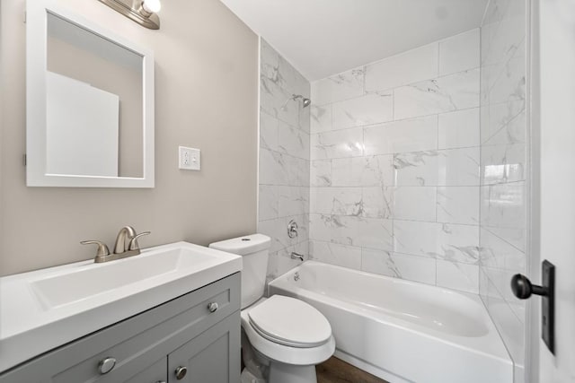 full bathroom featuring toilet, vanity, and bathtub / shower combination