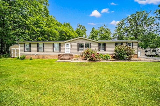 1706 Woodland Rd, Espyville, PA 16424 - manufactured / mobile home featuring a shed, a front lawn, and crawl space