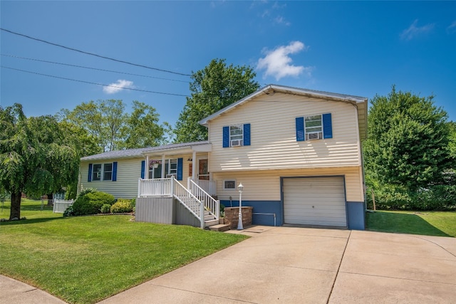 969 Lewis Way, Girard, PA 16417 - tri-level home with covered porch, concrete driveway, a garage, and a front yard