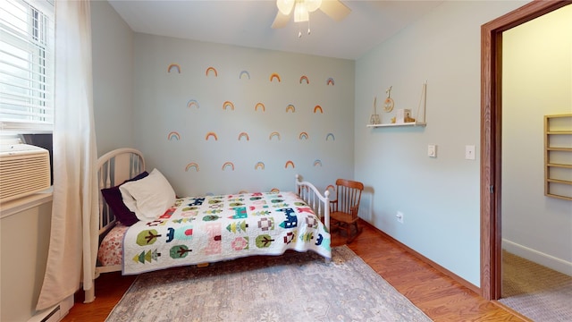969 Lewis Way, Girard, PA 16417 - bedroom featuring wood finished floors, ceiling fan, and baseboard heating