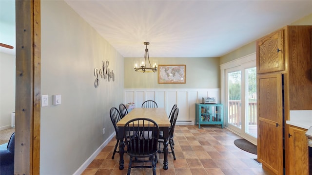 969 Lewis Way, Girard, PA 16417 - dining room featuring baseboard heating, a chandelier, and a wainscoted wall
