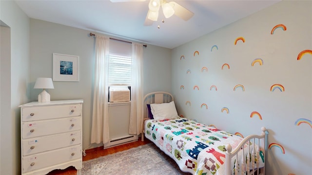 969 Lewis Way, Girard, PA 16417 - bedroom with a baseboard heating unit, wood finished floors, ceiling fan, and cooling unit