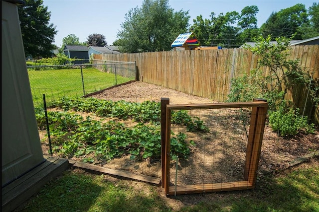 969 Lewis Way, Girard, PA 16417 - fenced backyard featuring a garden