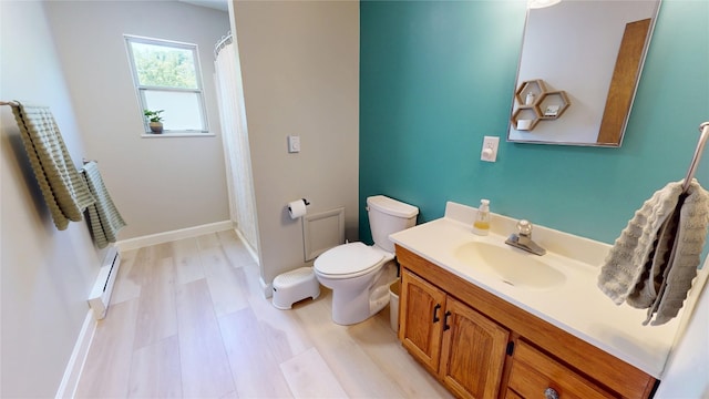 969 Lewis Way, Girard, PA 16417 - bathroom with a baseboard heating unit, vanity, wood finished floors, and a shower with shower curtain