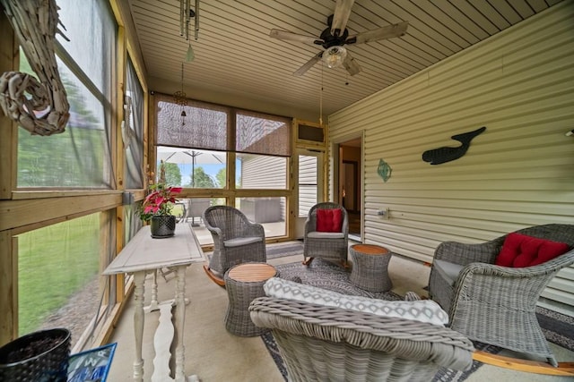 sunroom / solarium with ceiling fan and wood ceiling