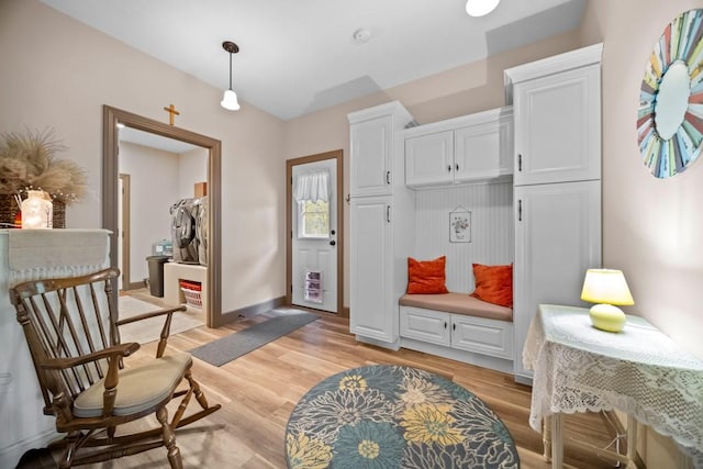 mudroom with light hardwood / wood-style floors