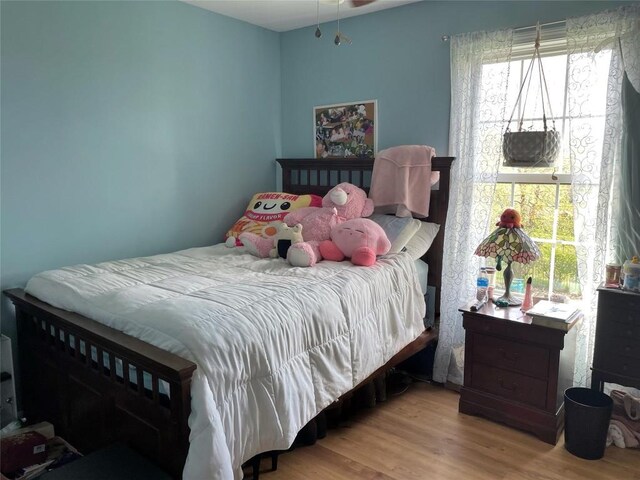 bedroom featuring wood finished floors