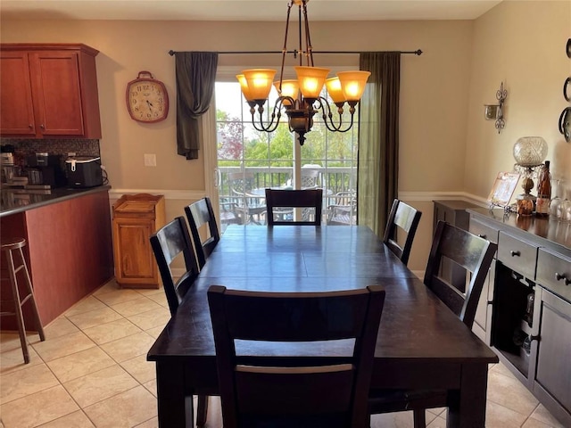 dining space featuring a chandelier and light tile patterned floors