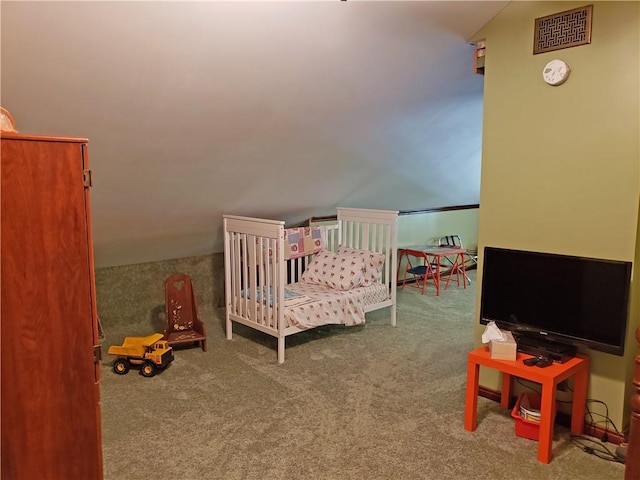 bedroom with carpet and vaulted ceiling