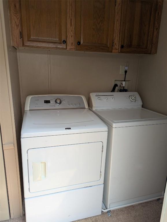 5005 Zuck Rd Unit 21, Erie, PA 16506 - laundry room with washer and dryer and cabinet space