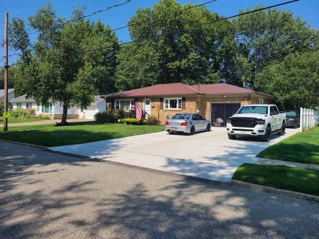 ranch-style home with a front lawn and a garage