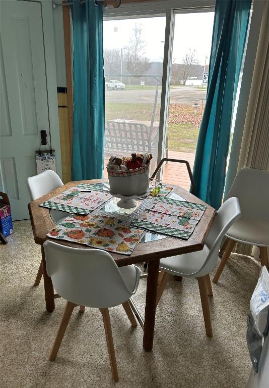 dining area featuring carpet flooring