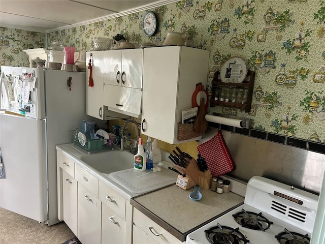 12656 Comstock St, Conneaut Lake, PA 16316 - kitchen featuring white appliances, wallpapered walls, white cabinets, and light countertops