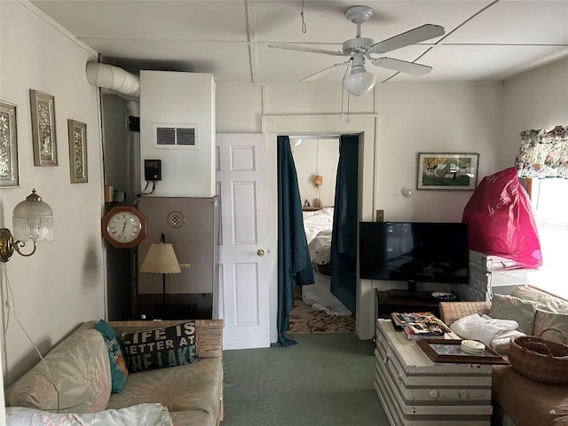 carpeted living room with ceiling fan