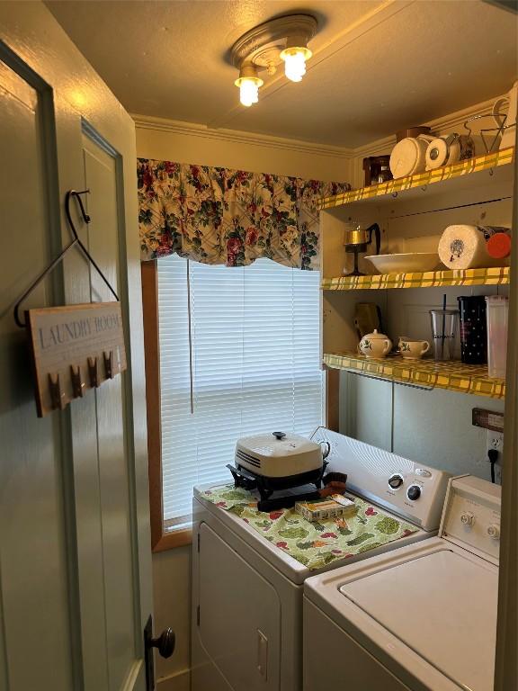 12656 Comstock St, Conneaut Lake, PA 16316 - laundry room featuring washer and clothes dryer and ornamental molding