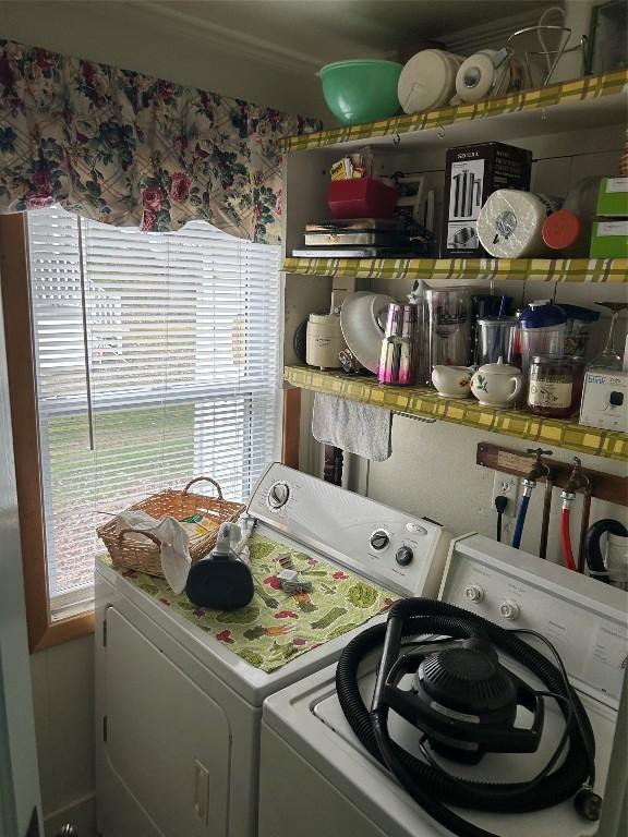 laundry area with independent washer and dryer