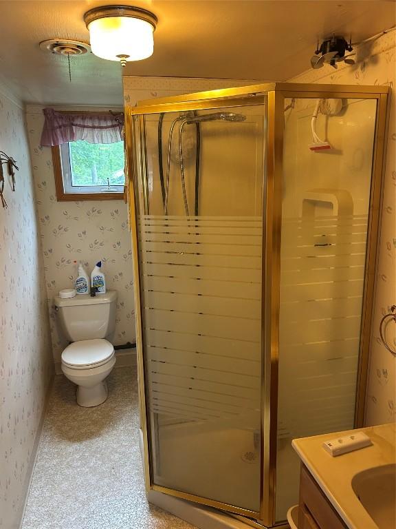 12656 Comstock St, Conneaut Lake, PA 16316 - bathroom featuring wallpapered walls, a stall shower, and vanity