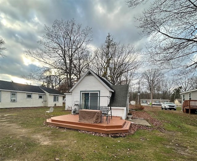12656 Comstock St, Conneaut Lake, PA 16316 - rear view of house featuring a wooden deck, a yard, and roof with shingles