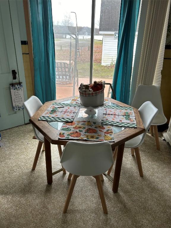 dining space featuring carpet