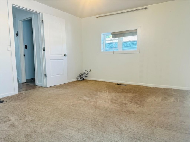 empty room with light colored carpet