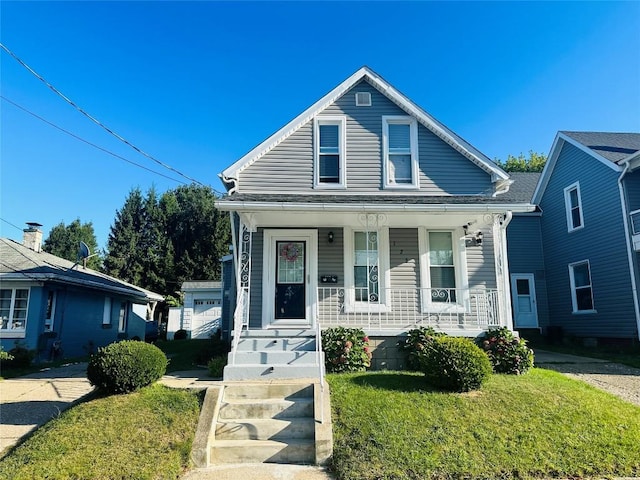 bungalow-style house with a front yard